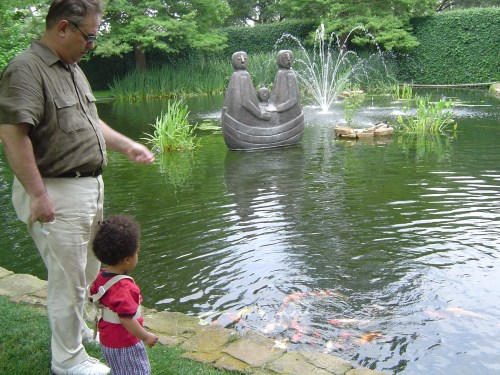 Alexander and Daddy hanging out at the koi pond at the Anatole Hotel in Dallas.